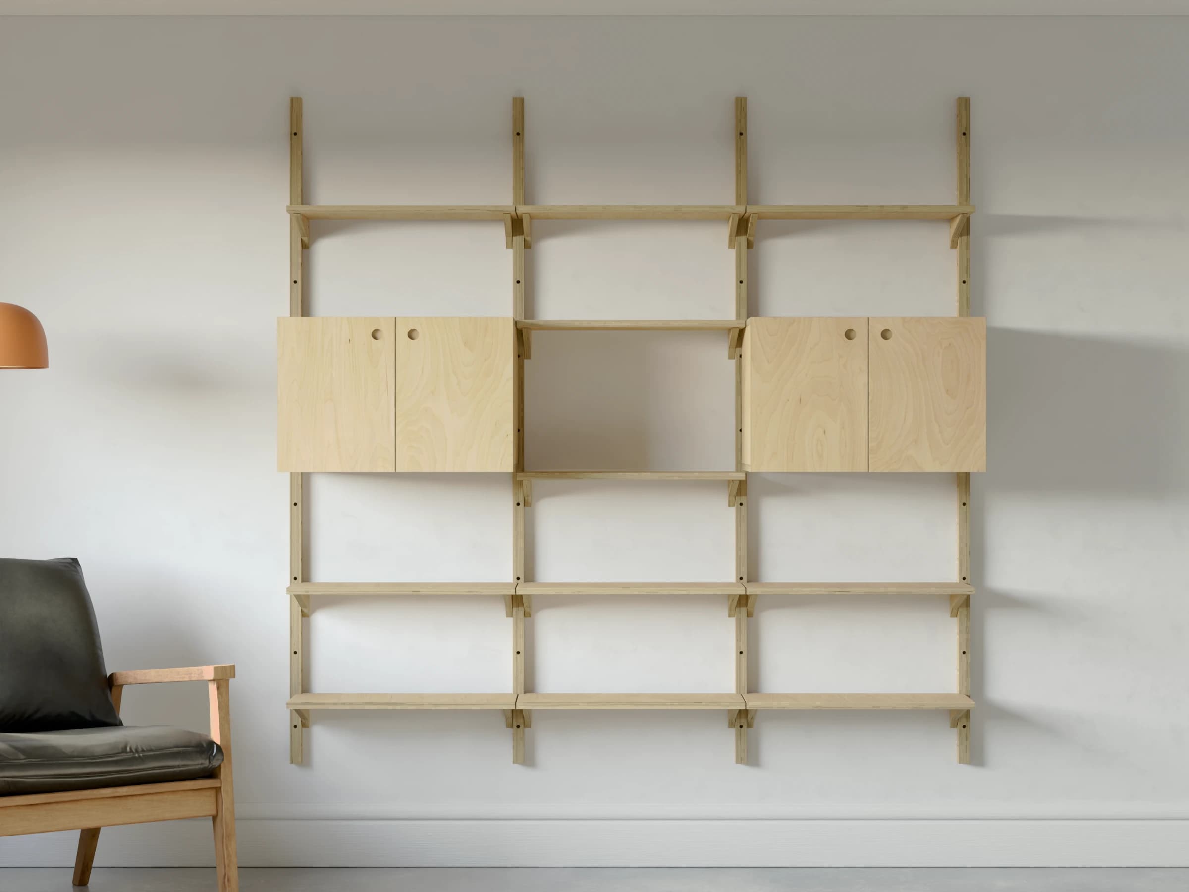 Three bays of birch plywood shelving from the front, with two-door cupboards at eye level in the outer bays and open shelves in the middle