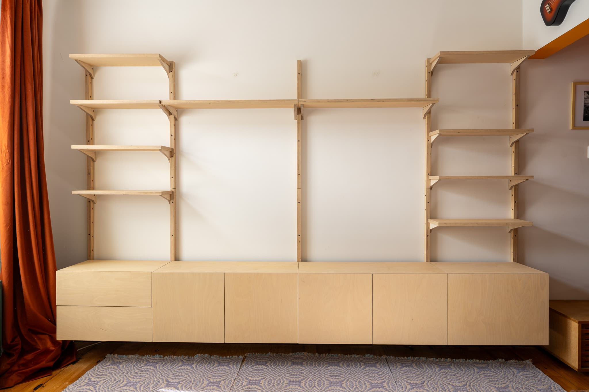 Full Mestra wall-mounted shelving system with shelves and birch plywood cabinet storage